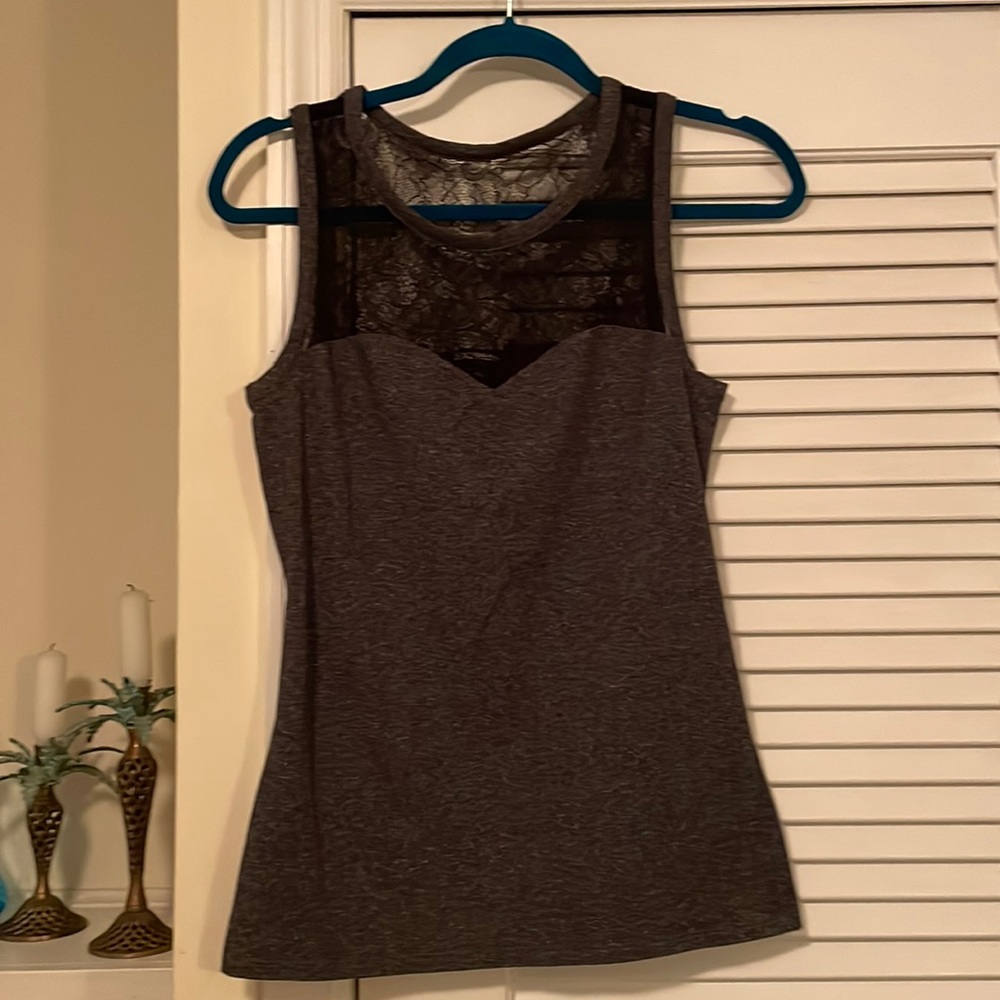 Sleeveless stretchy knit top with lace inset; Flirty and comfortable
